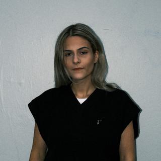 J.